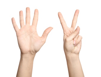 Photo of Woman showing sign seven on white background, closeup. Body language