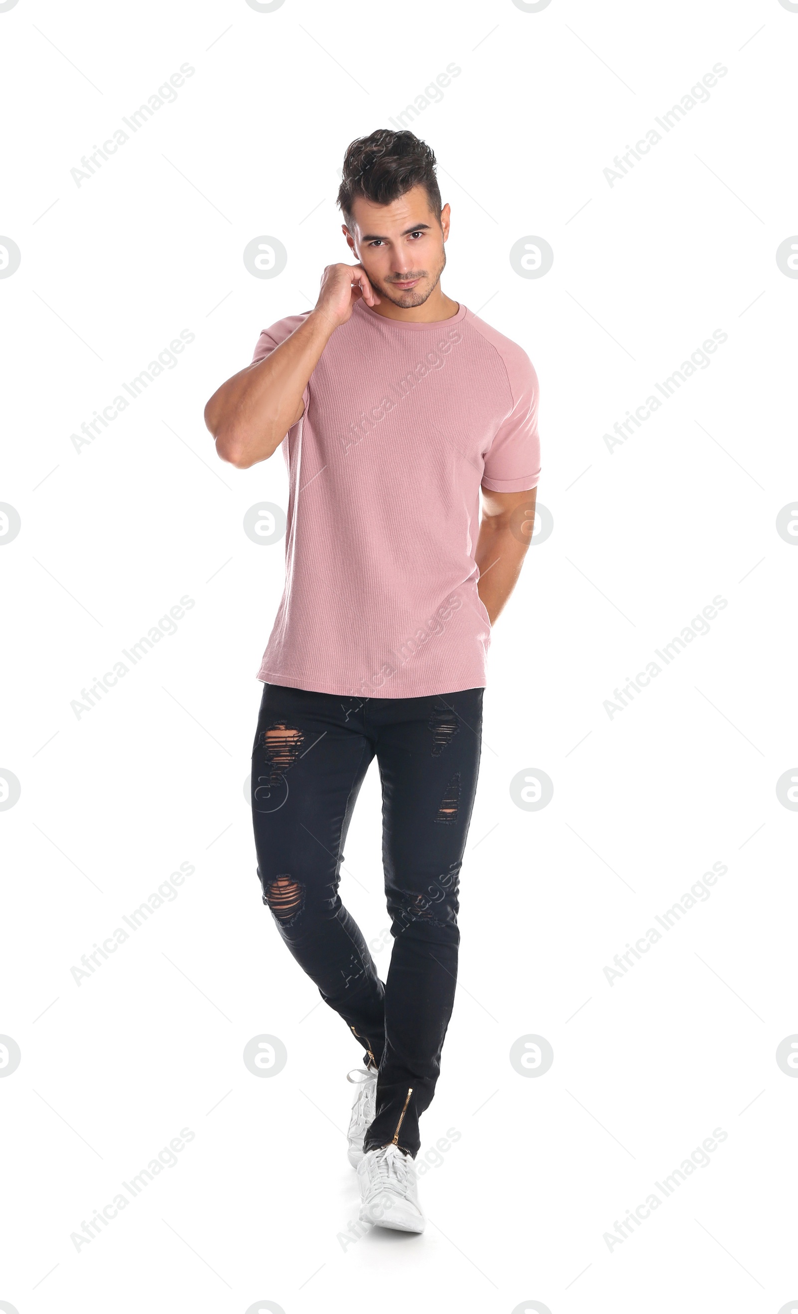 Photo of Young man in stylish jeans on white background