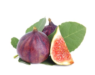 Fresh juicy purple figs and green leaves on white background