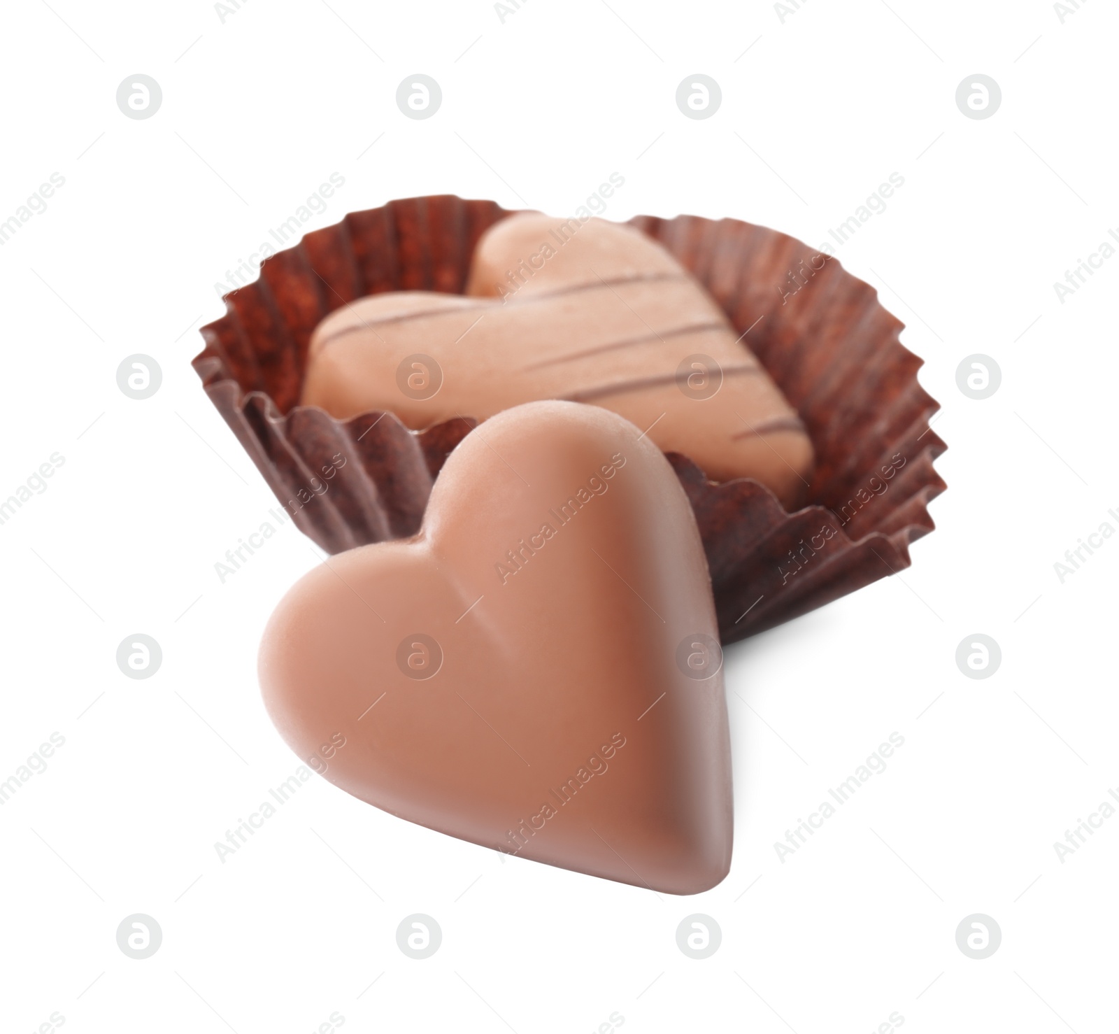 Photo of Tasty heart shaped chocolate candies on white background. Valentine's day celebration