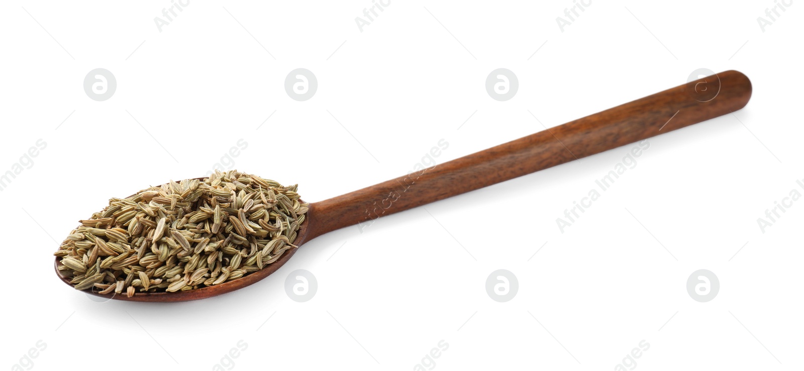 Photo of Dry fennel seeds in spoon isolated on white