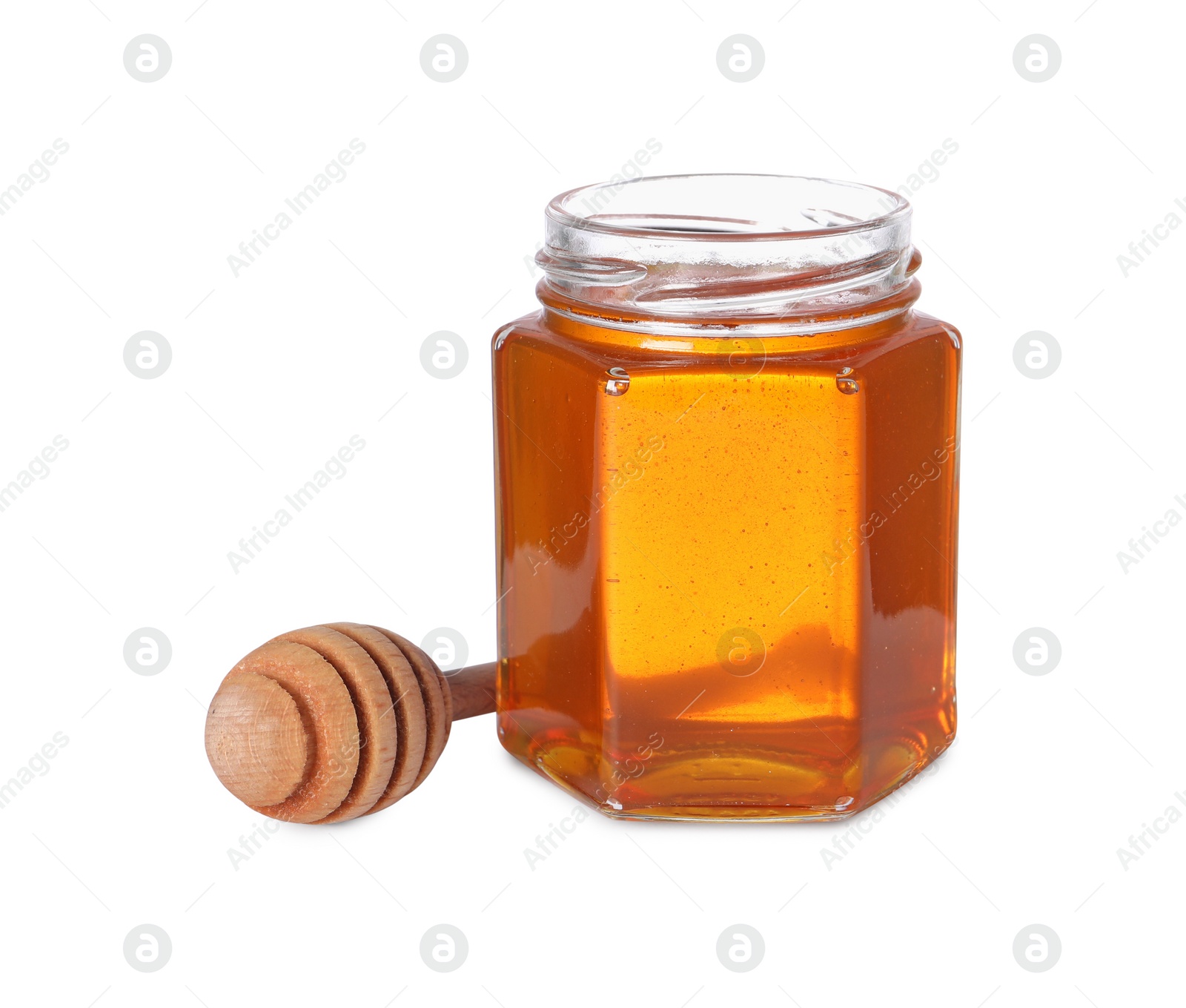 Photo of Tasty natural honey in glass jar and dipper isolated on white