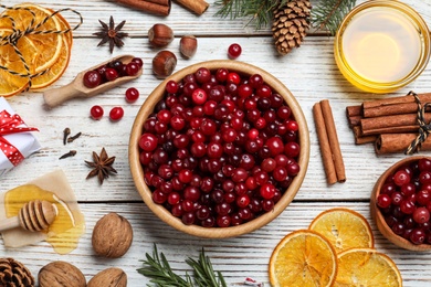 Photo of Flat lay composition with fresh ripe cranberries on white wooden table