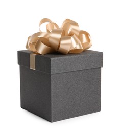 Photo of Black gift box with golden bow on white background