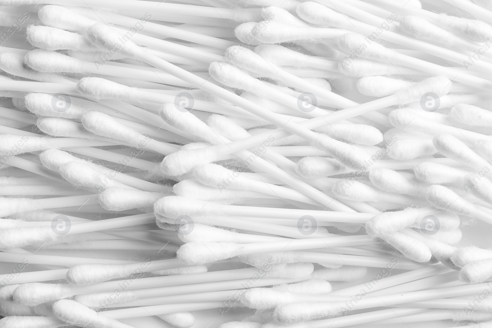 Photo of Pile of cotton swabs as background, top view