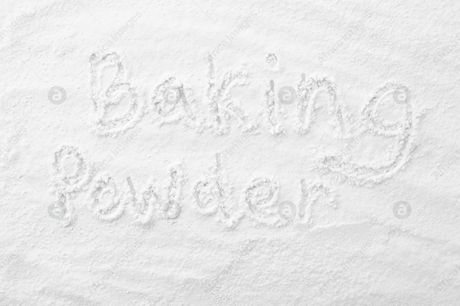 Photo of Words Baking Powder written on powder, top view