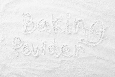 Photo of Words Baking Powder written on powder, top view