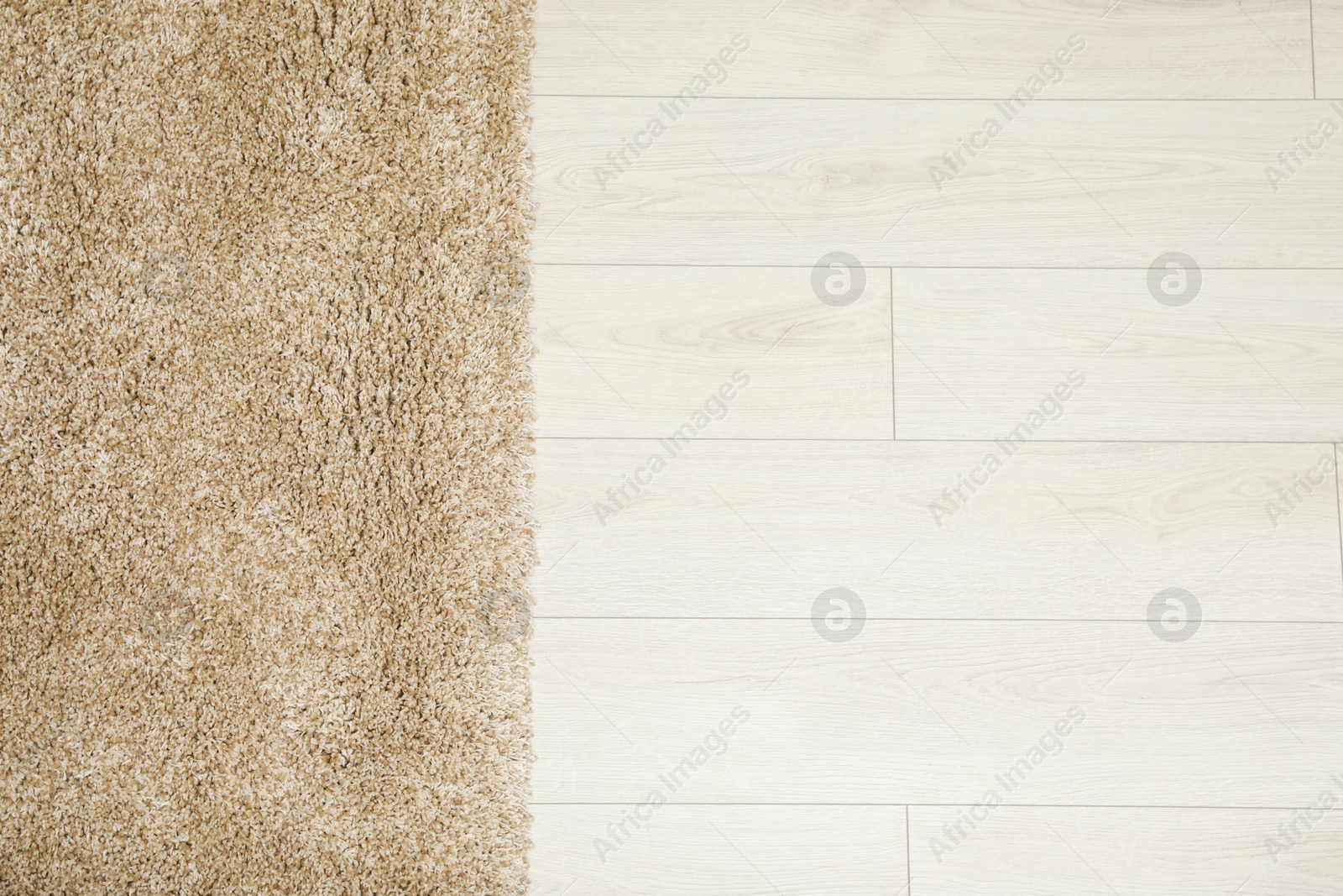 Photo of Beautiful beige carpet on floor, top view. Space for text