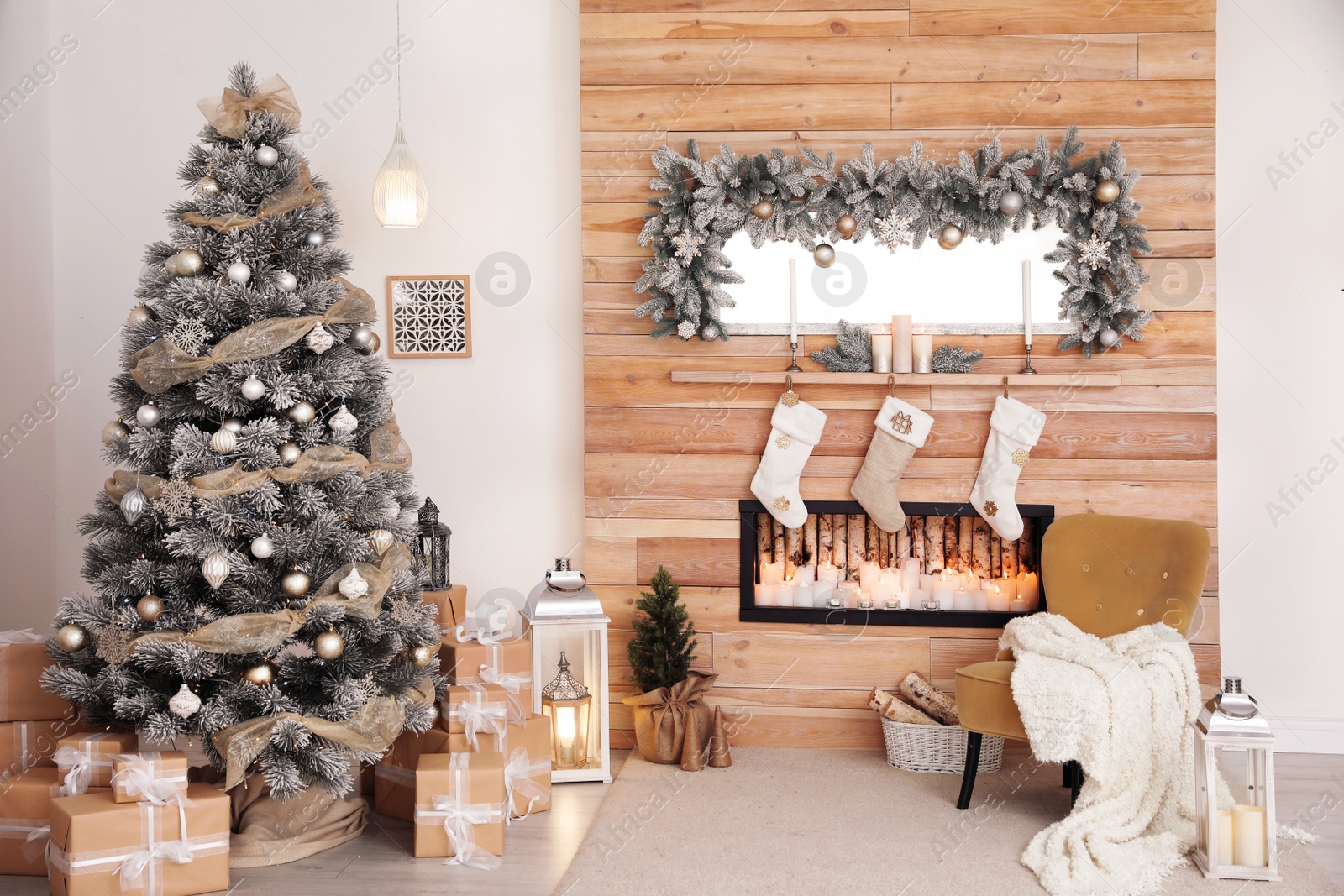 Photo of Festive interior with decorated Christmas tree and fireplace