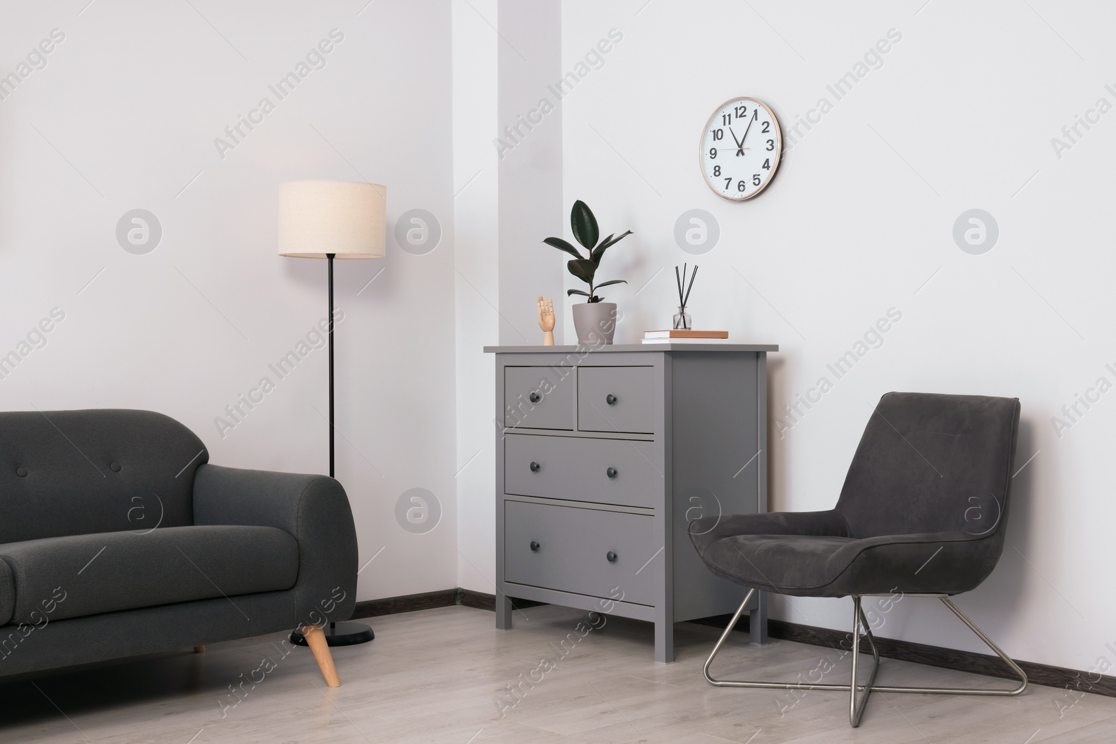 Photo of Stylish room interior with sofa and other furniture