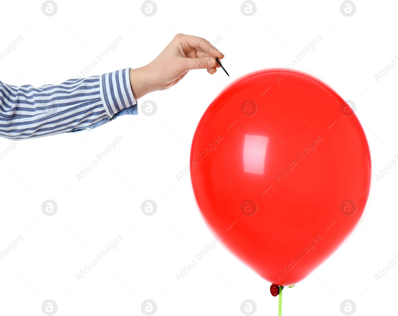 Photo of Woman piercing red balloon on white background, closeup