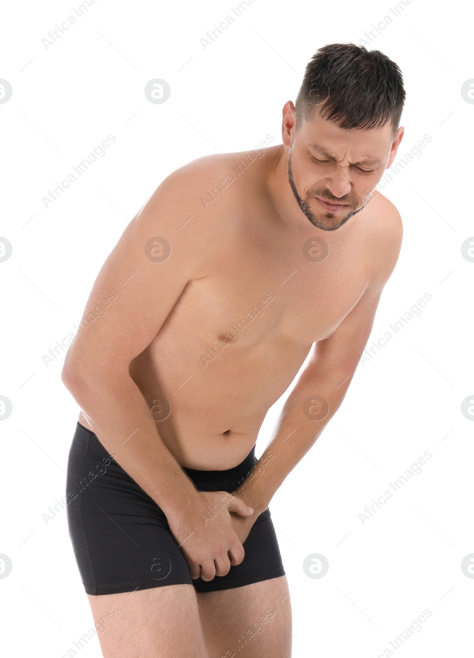 Photo of Man suffering from pain on white background. Urology problems