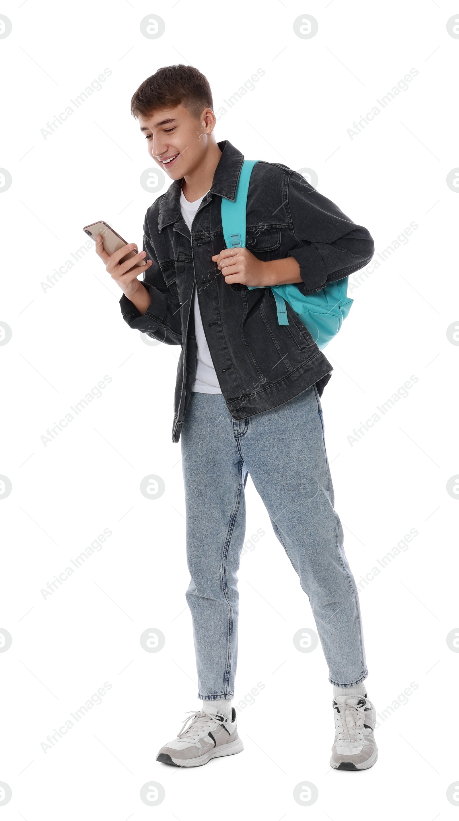 Photo of Teenage boy with backpack using smartphone on white background