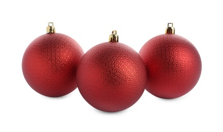 Photo of Beautiful red Christmas balls on white background