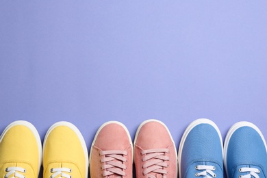 Photo of Different bright stylish shoes on color background, flat lay. Space for text