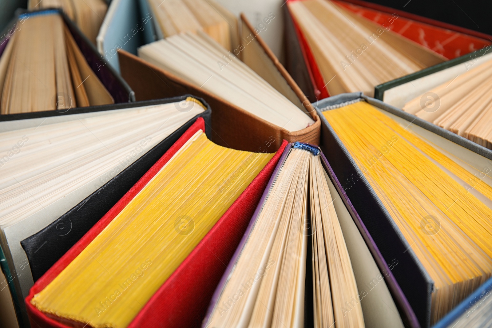 Photo of Stack of hardcover books as background, closeup