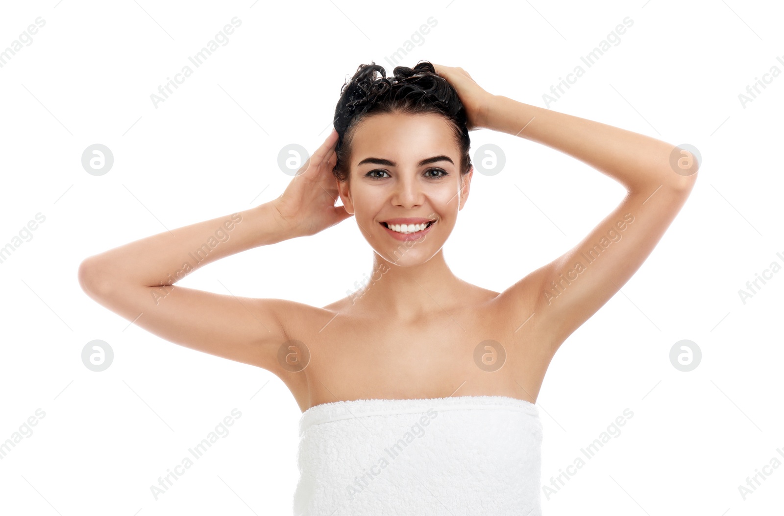 Photo of Beautiful young woman washing hair on white background