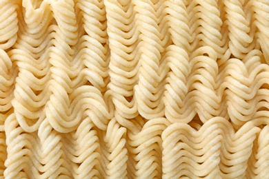 Photo of Quick cooking noodles as background, closeup view