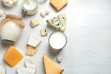 Photo of Different delicious dairy products on white table, flat lay. Space for text