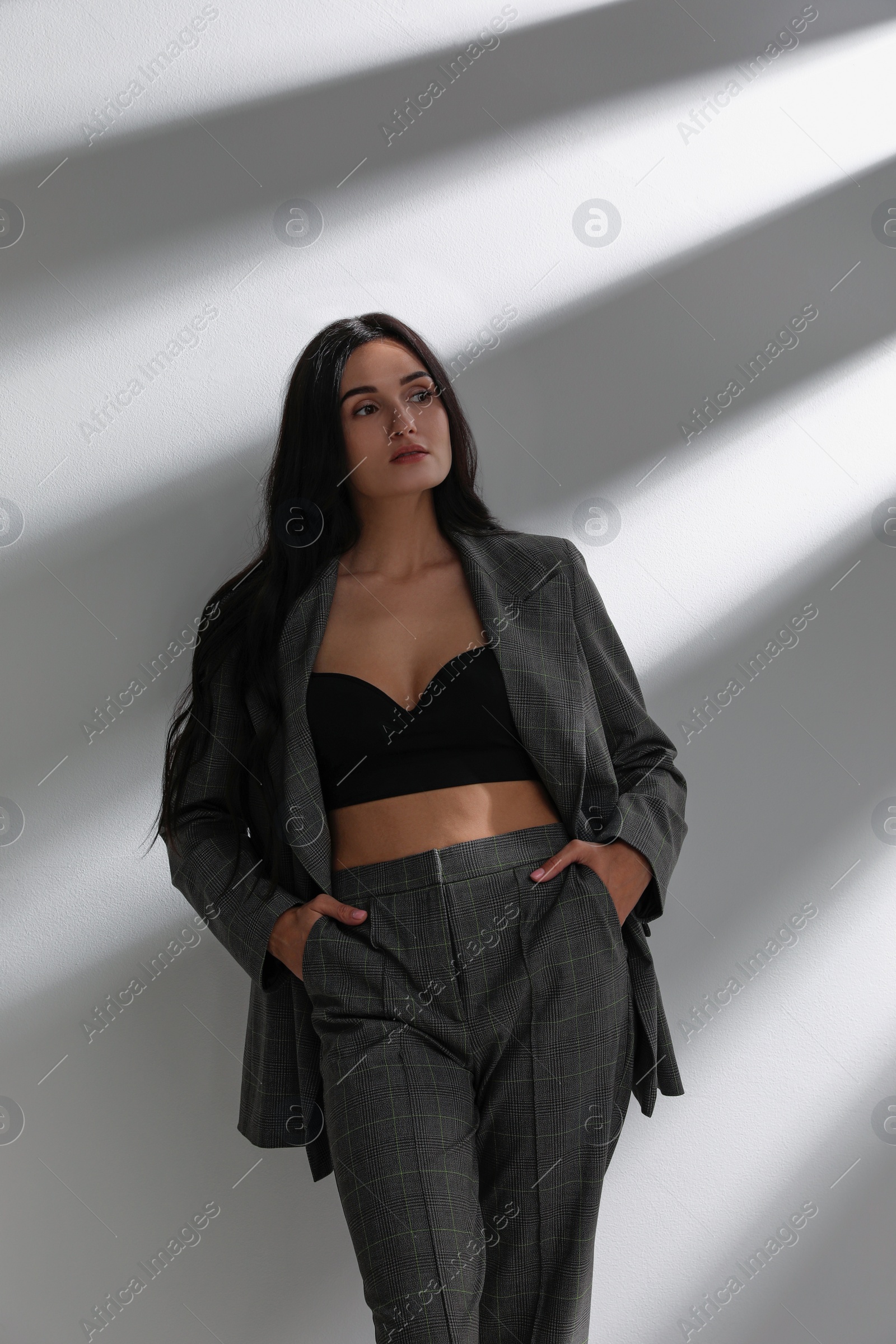 Photo of Beautiful woman in formal suit on white background. Business attire