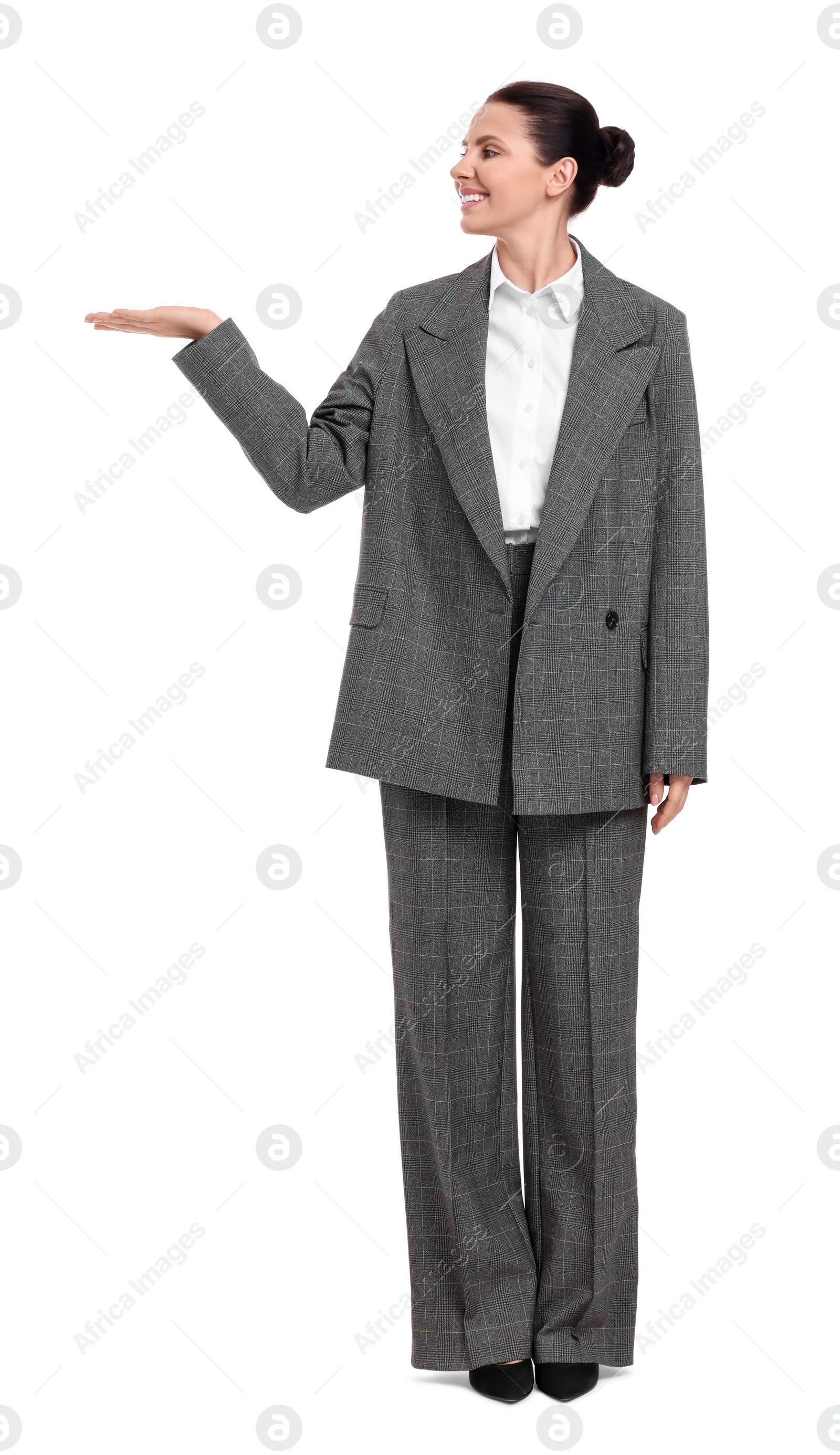 Photo of Beautiful businesswoman in suit pointing at something on white background