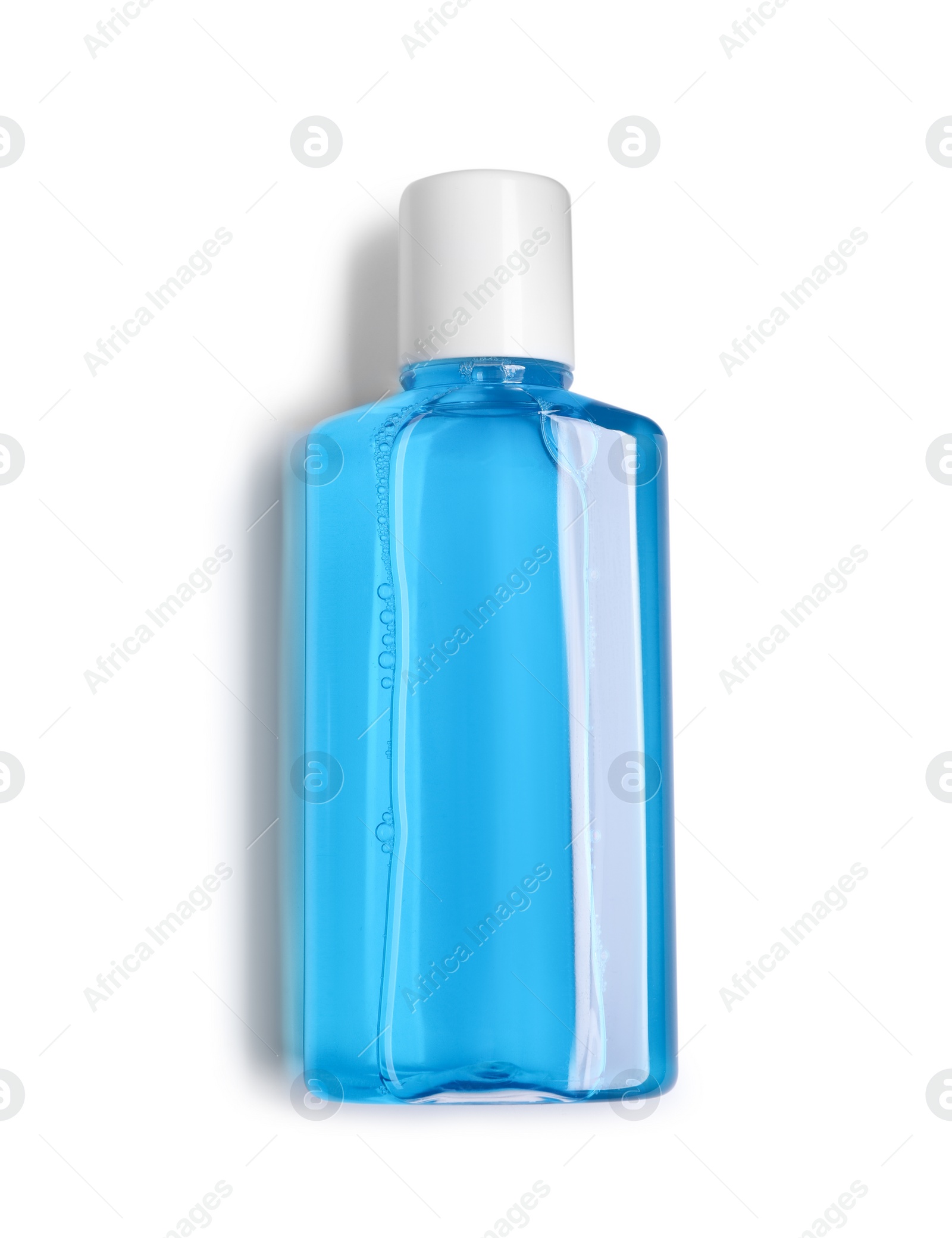 Photo of Fresh mouthwash in bottle isolated on white, top view