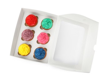 Photo of Box with different cupcakes on white background, top view