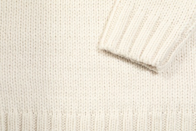 Texture of cozy warm sweater as background, closeup