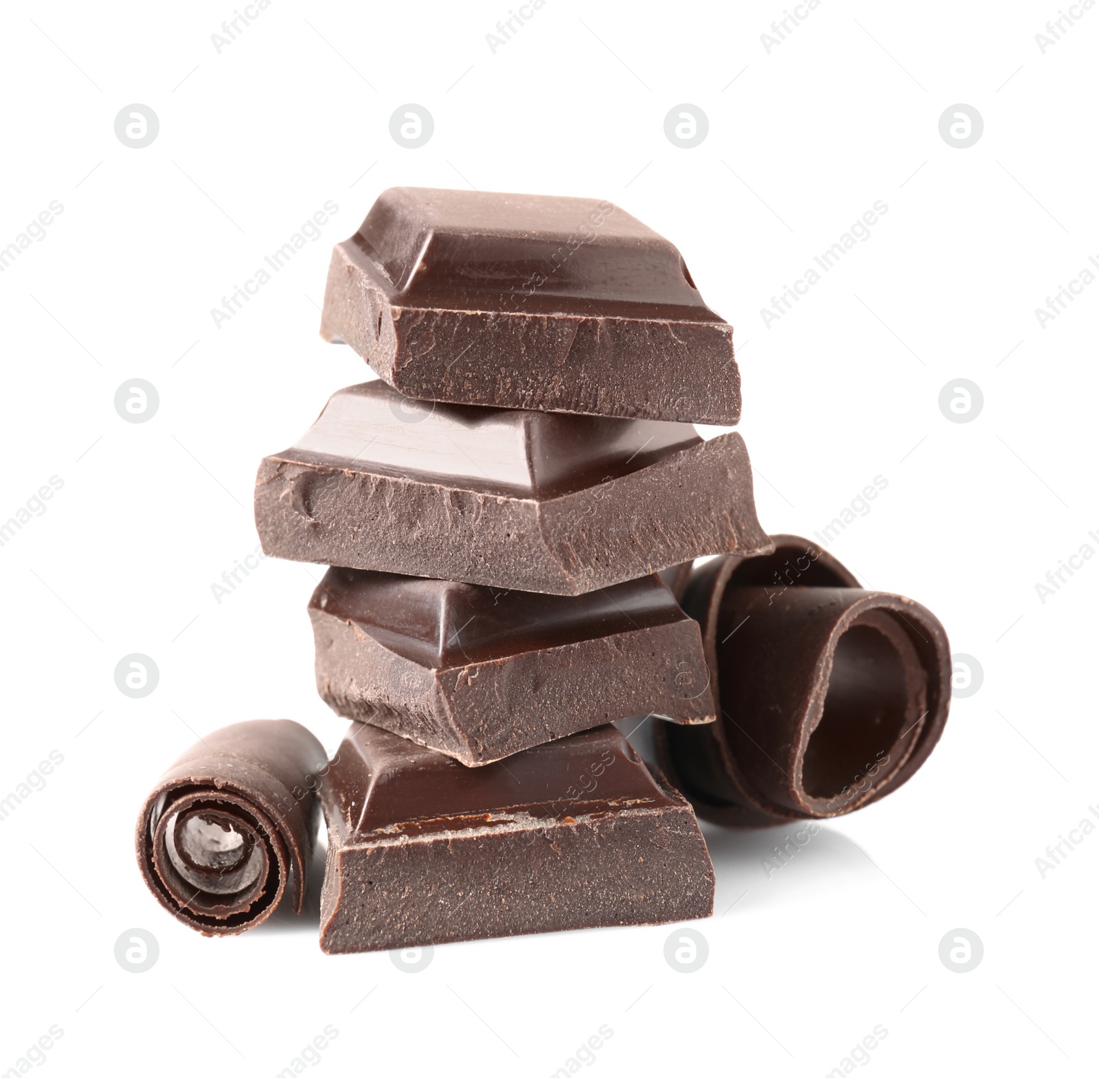 Photo of Yummy chocolate curls and pieces on white background