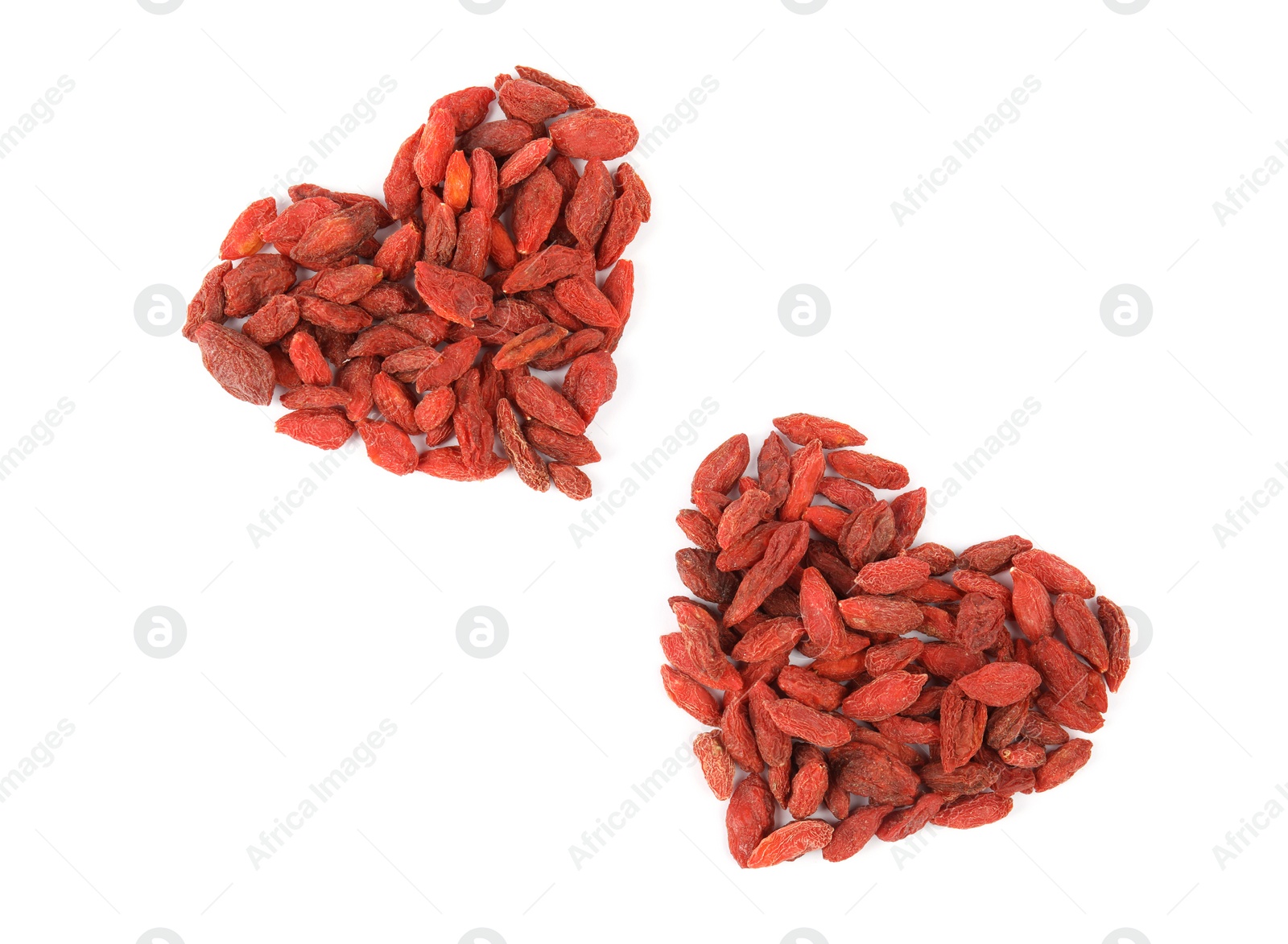 Photo of Heart shaped piles of dried goji berries on white background, top view