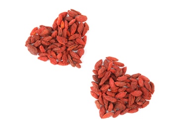 Photo of Heart shaped piles of dried goji berries on white background, top view