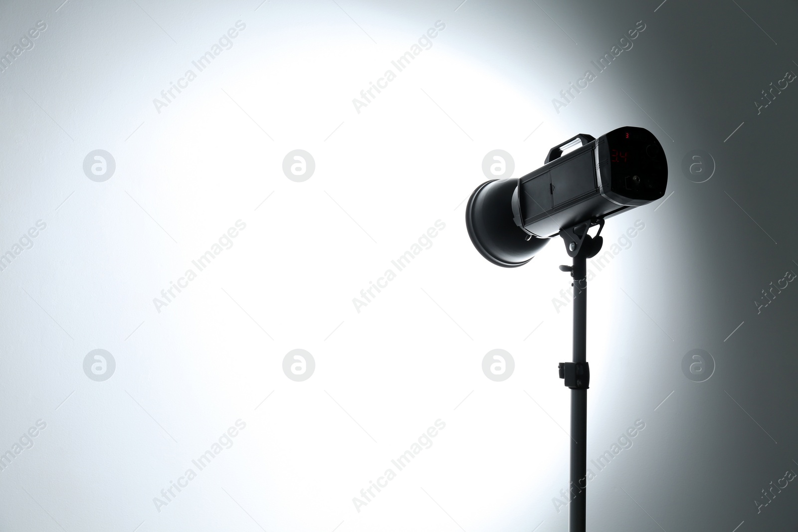 Photo of Studio lighting against white background. Professional photo equipment