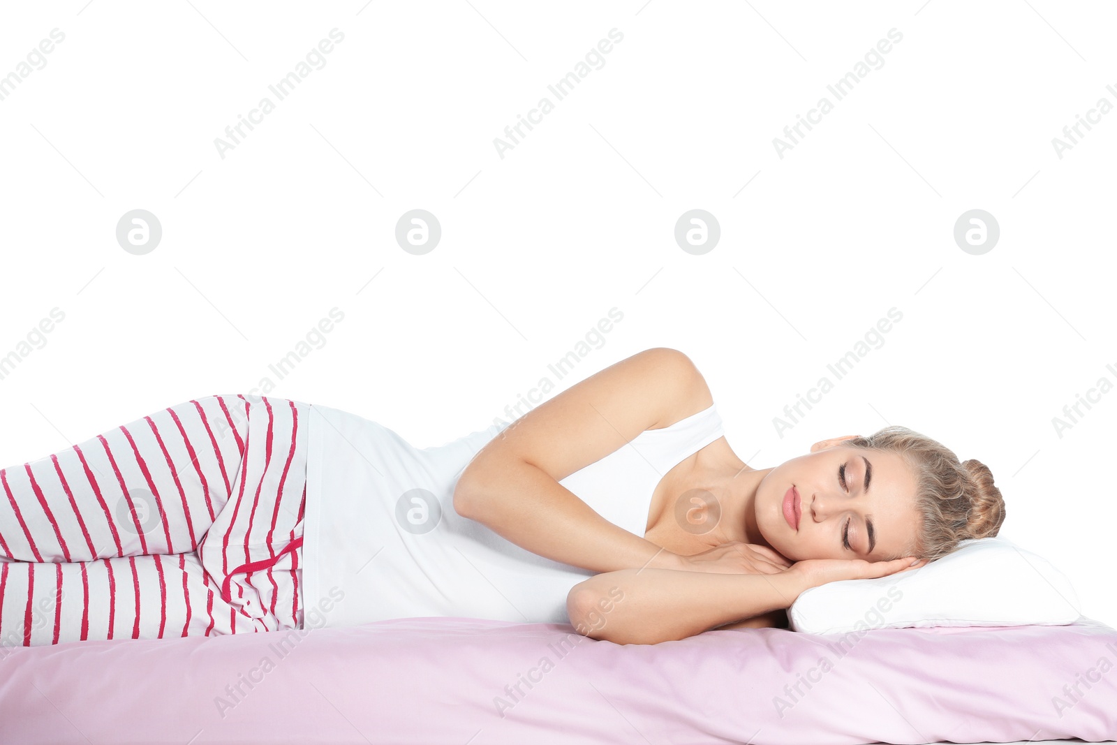 Photo of Beautiful woman sleeping with orthopedic pillow on bed against white background