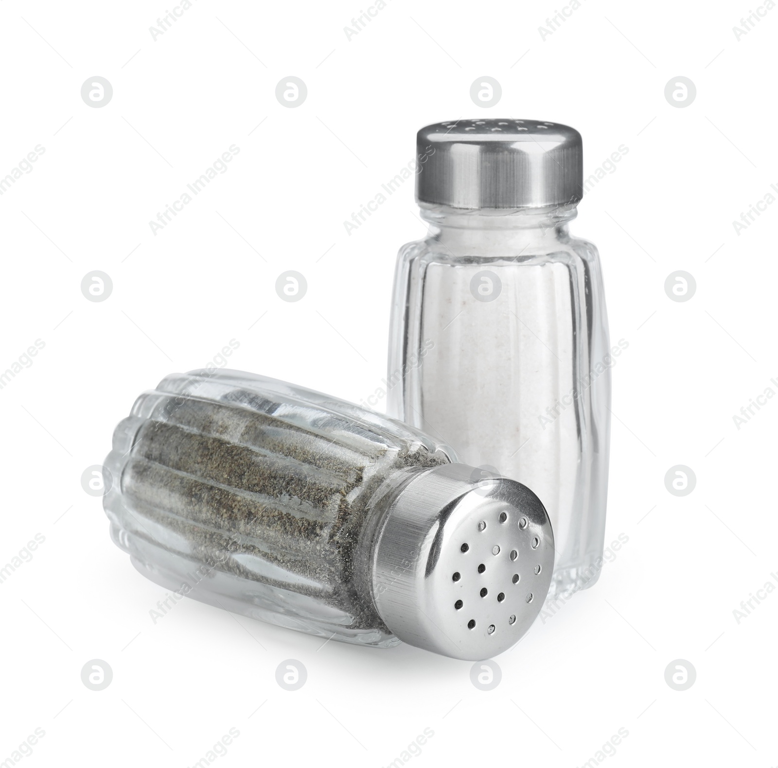 Photo of Salt and pepper shakers on white background