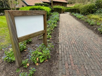 Sign board, pathway and beautiful building outdoors