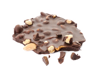 Delicious black chocolate with nuts on white background