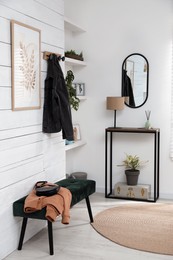 Hallway interior with console table and stylish decor