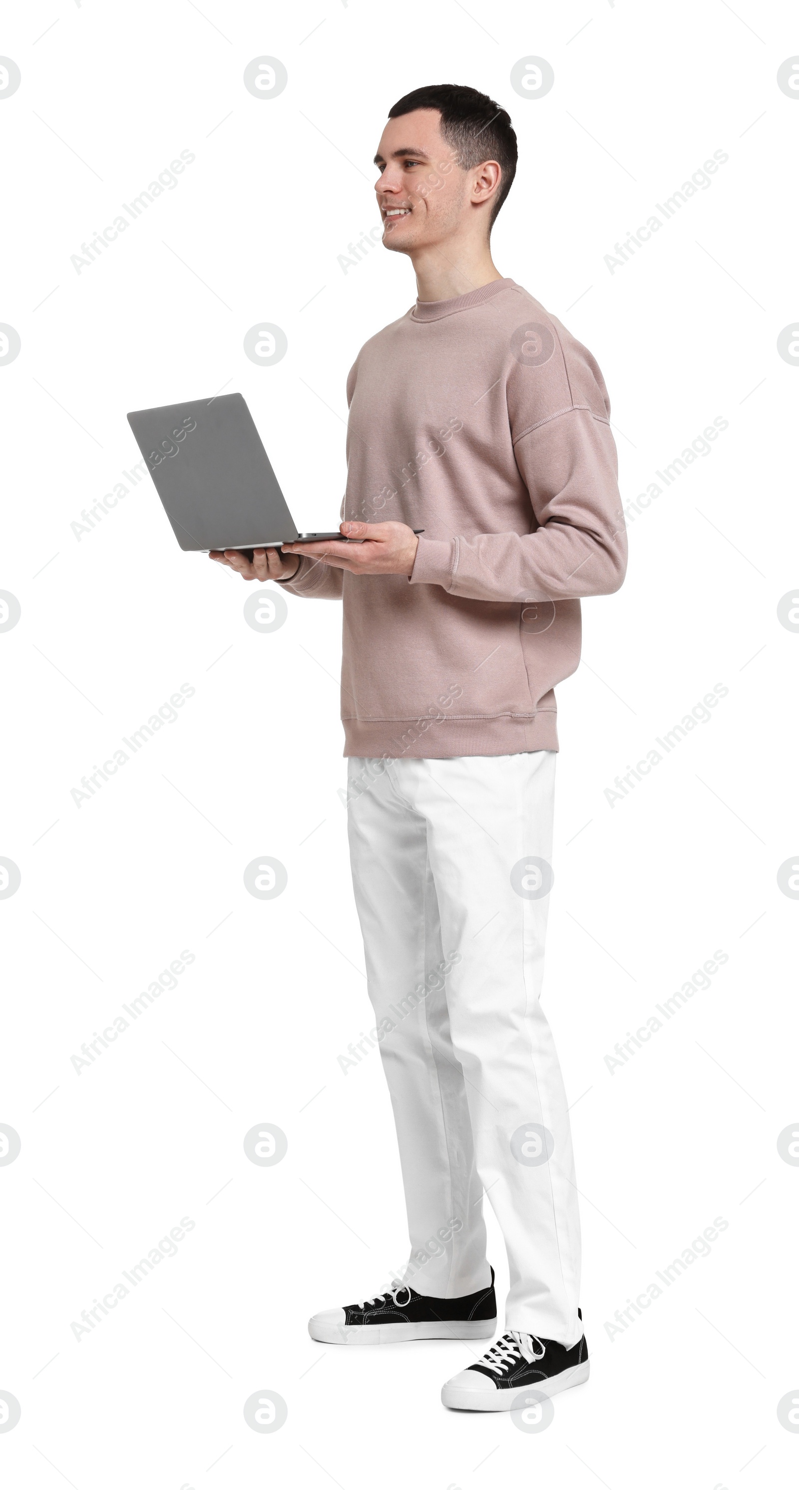 Photo of Handsome young man with laptop on white background