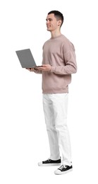 Handsome young man with laptop on white background