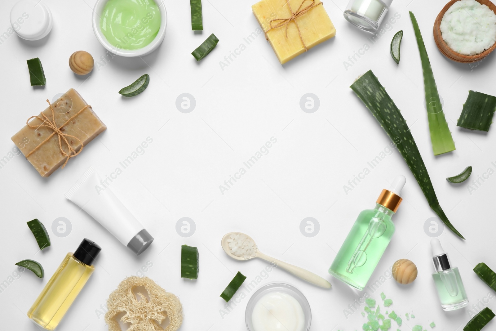 Photo of Flat lay composition with aloe vera and cosmetic products on white background. Space for text