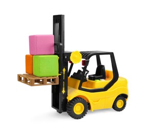 Photo of Yellow loader with cubes isolated on white. Children's toy