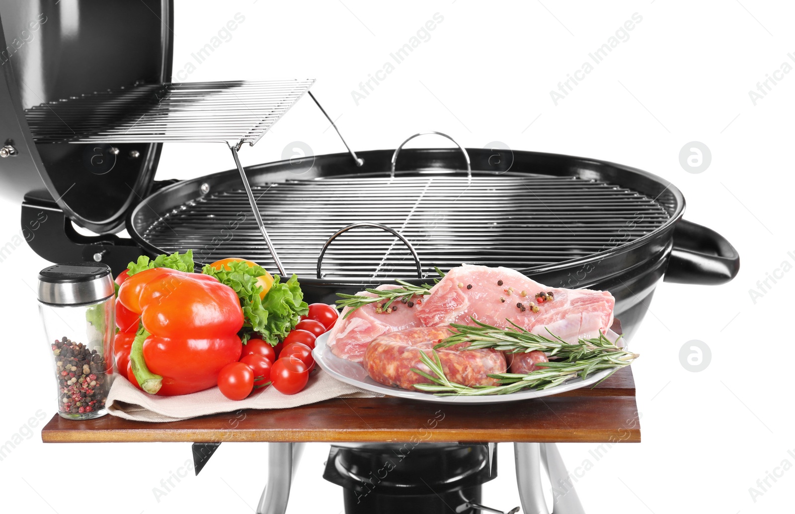 Photo of Modern barbecue grill with tasty food on white background