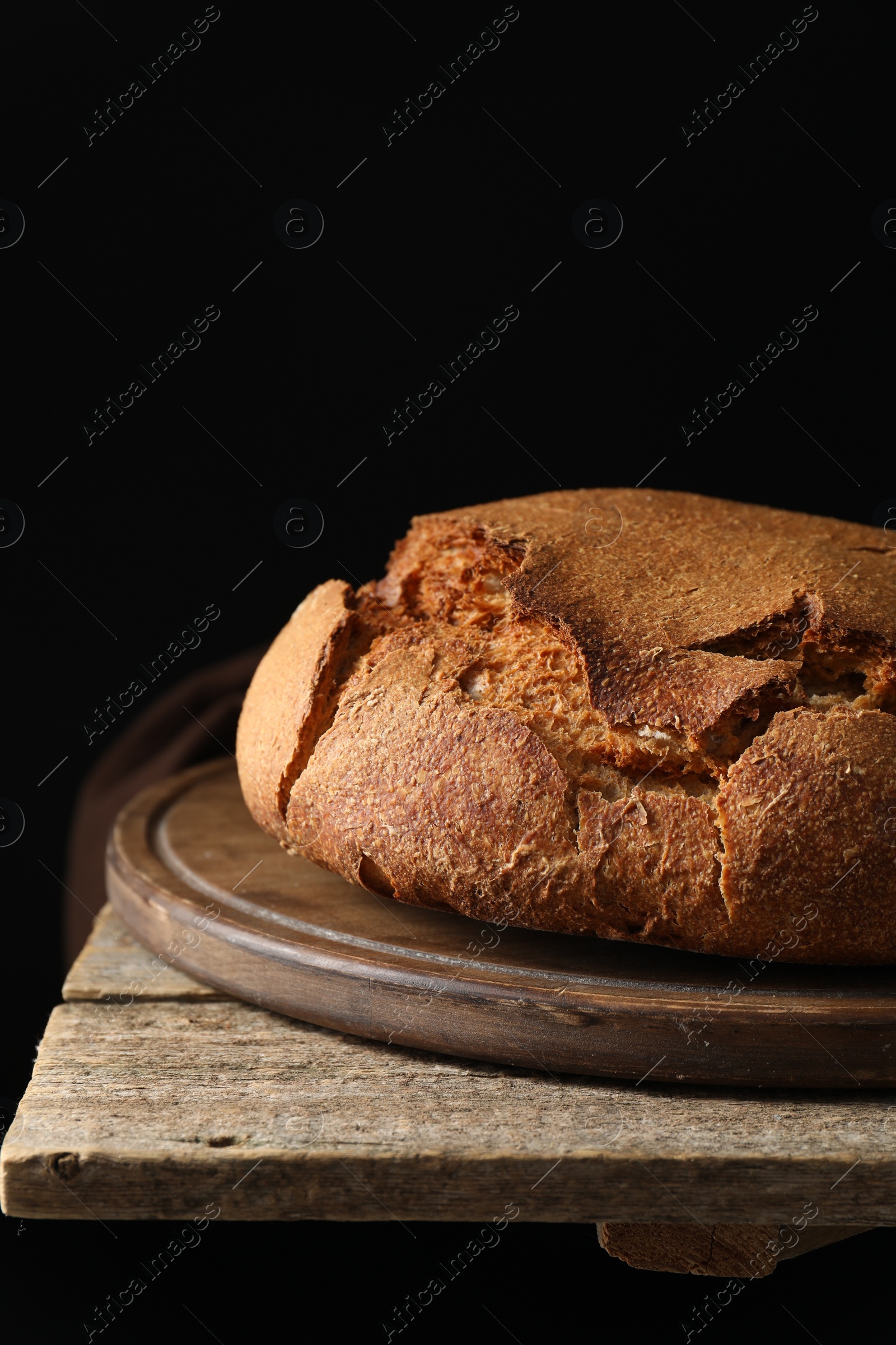 Photo of Freshly baked sourdough bread on wooden table