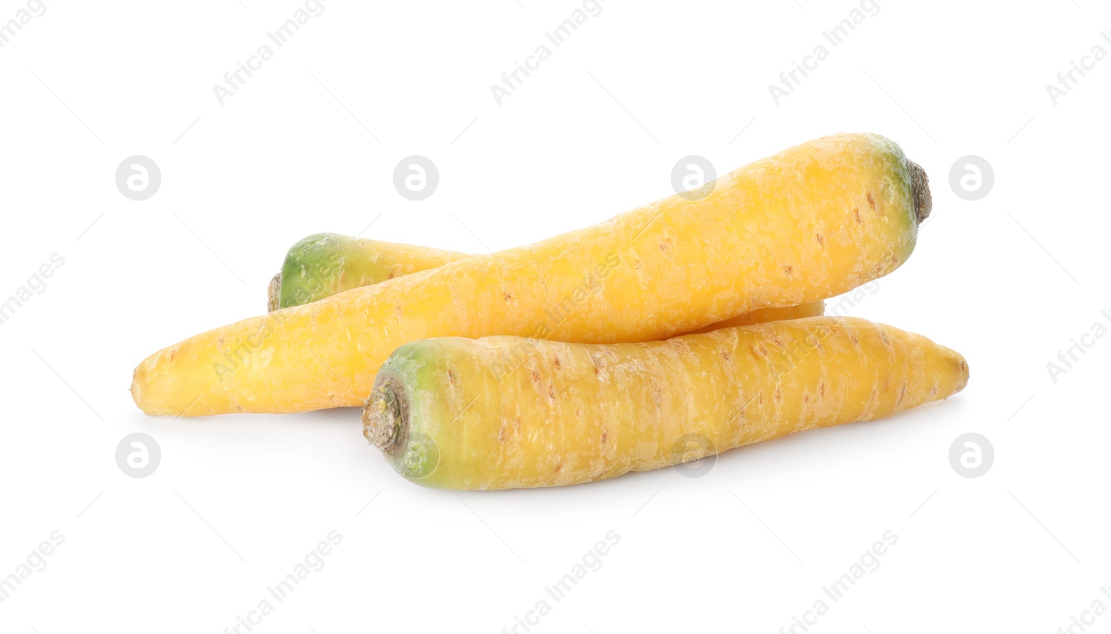 Photo of Fresh raw yellow carrots isolated on white