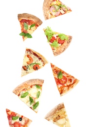 Image of Pieces of different pizzas falling on white background