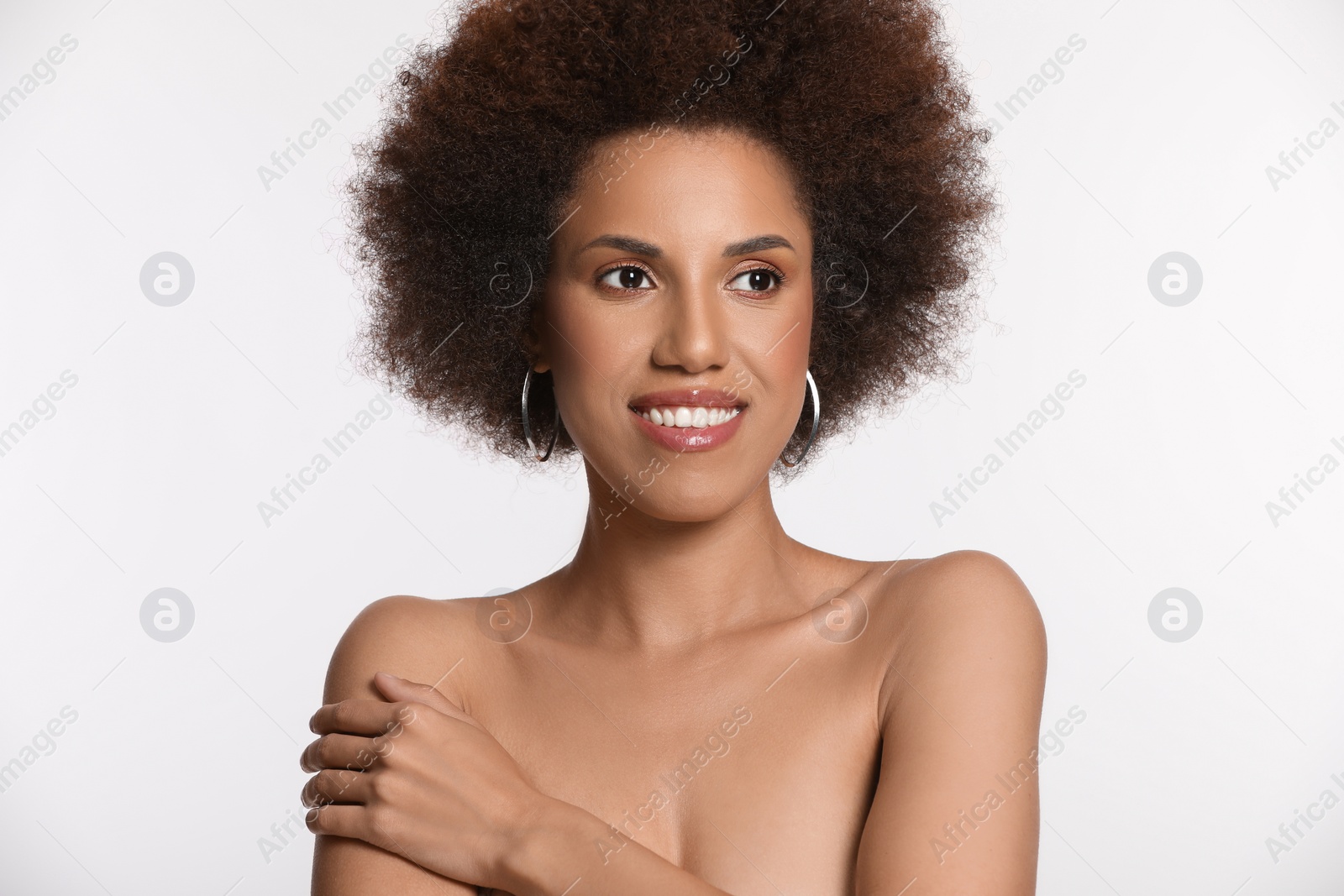 Photo of Portrait of beautiful young woman with glamorous makeup on white background