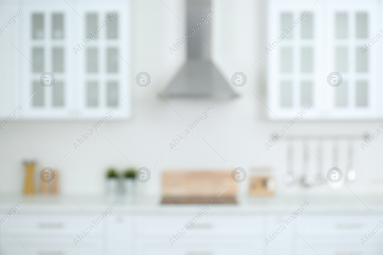 Photo of Blurred view of modern stylish kitchen interior