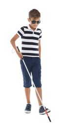 Blind boy with long cane walking on white background