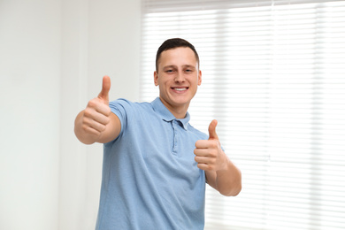 Portrait of handsome young man at home