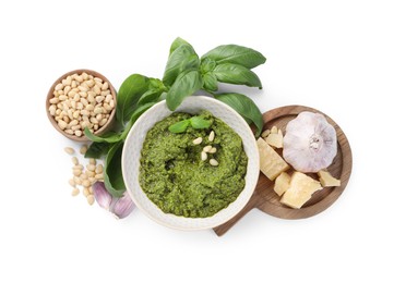 Photo of Fresh tasty pesto sauce and ingredients isolated on white, top view